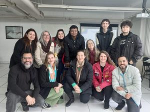 fotografia com a presença de 12 pessoas presentes na reunião do NUCRESS. 